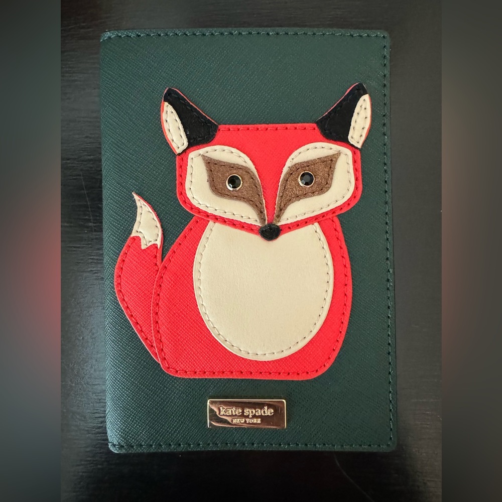Selling my wife’s  Kate Spade “Blaze a Trail” Fox passport holder/ wallet. Nwt